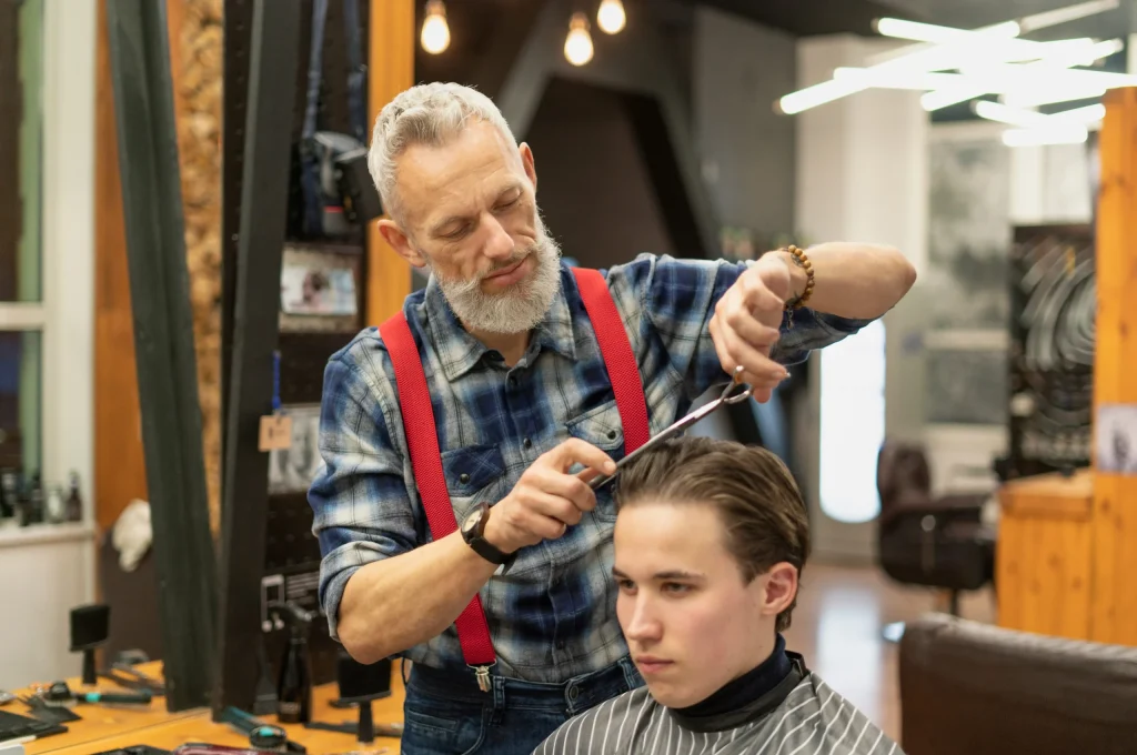 close-up-young-man-getting-haircut (1)